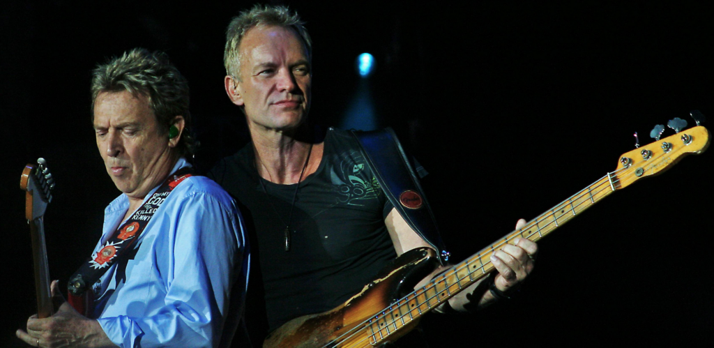 English musician Sting onstage with guitarist Dominic Miller